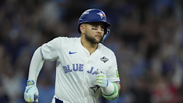 Nov 1, 2025; Toronto, Ontario, CAN; Toronto Blue Jays designated hitter Bo Bichette (11) runs after hitting a three run home run against the Los Angeles Dodgers in the third inning during game seven of the 2025 MLB World Series at Rogers Centre. Mandatory Credit: John E. Sokolowski-Imagn Images