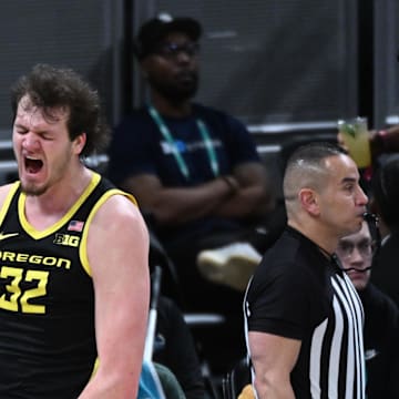 Mar 14, 2025; Indianapolis, IN, USA; Oregon Ducks center Nate Bittle (32) celebrates after a play during the second half against the Michigan State Spartans at Gainbridge Fieldhouse. Mandatory Credit: Robert Goddin-Imagn Images
