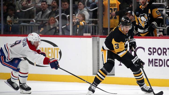 Nov 2, 2024; Pittsburgh, Pennsylvania, USA;  Pittsburgh Penguins defenseman Jack St. Ivany (3) moves the puck ahead of Montreal Canadiens defenseman Mike Matheson (8) during the third period at PPG Paints Arena. Mandatory Credit: Charles LeClaire-Imagn Images