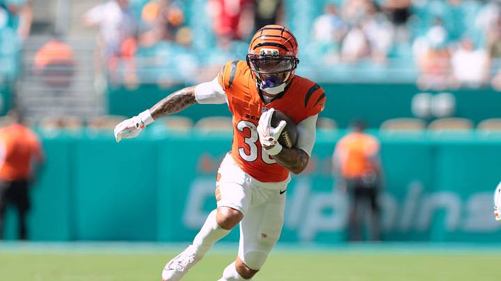 Oct 11, 2026; Miami Gardens, Florida, USA;  Cincinnati Bengals halfback Chase Brown (30) runs with the ball against the Miami Dolphins during the second quarter at Hard Rock Stadium.  Mandatory Credit: Sam Navarro-Imagn Images