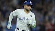 Nov 1, 2025; Toronto, Ontario, CAN; Toronto Blue Jays designated hitter Bo Bichette (11) runs after hitting a three run home run against the Los Angeles Dodgers in the third inning during game seven of the 2025 MLB World Series at Rogers Centre. Mandatory Credit: John E. Sokolowski-Imagn Images