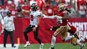 Nov 10, 2024; Tampa, Florida, USA; Tampa Bay Buccaneers quarterback Baker Mayfield (6) runs with the ball against the San Francisco 49ers in the fourth quarter at Raymond James Stadium.  