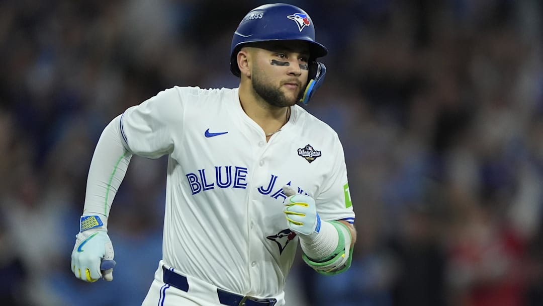 Nov 1, 2025; Toronto, Ontario, CAN; Toronto Blue Jays designated hitter Bo Bichette (11) runs after hitting a three run home run against the Los Angeles Dodgers in the third inning during game seven of the 2025 MLB World Series at Rogers Centre. 