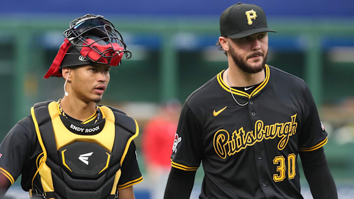 Apr 14, 2025; Pittsburgh, Pennsylvania, USA;  Pittsburgh Pirates catcher Endy Rodriguez (5) and starting pitcher Paul Skenes (30) make their way in from the bullpen to play the Washington Nationals at PNC Park. Mandatory Credit: Charles LeClaire-Imagn Images
