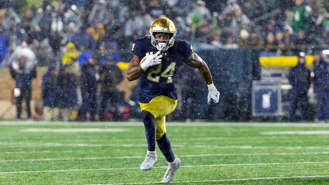 Nov 8, 2025; South Bend, Indiana, USA; Notre Dame Fighting Irish running back Jadarian Price (24) runs the ball against the Navy Midshipmen during the second half at Notre Dame Stadium. Mandatory Credit: Michael Caterina-Imagn Images