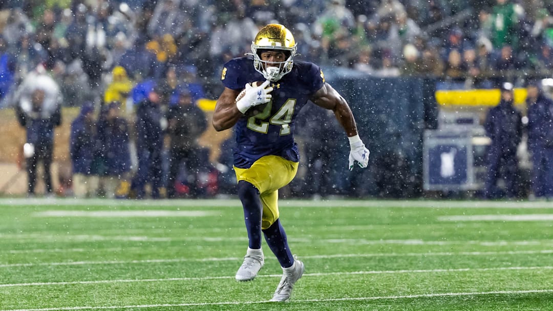 Nov 8, 2025; South Bend, Indiana, USA; Notre Dame Fighting Irish running back Jadarian Price (24) runs the ball against the Navy Midshipmen during the second half at Notre Dame Stadium. Mandatory Credit: Michael Caterina-Imagn Images