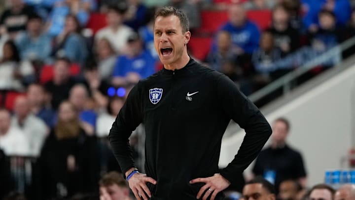 Mar 21, 2025; Raleigh, NC, USA; Duke Blue Devils head coach Jon Scheyer reacts during the first half against the Mount St. Mary's Mountaineers in the first round of the NCAA Tournament.