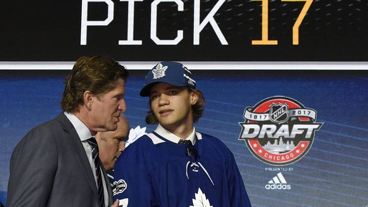 June 23, 2017; Chicago, IL, USA; Timothy Liljegren (right) speaks with head coach Mike Babcock after being selected as the number seventeen overall pick to the Toronto Maple Leafs in the first round of the 2017 NHL Draft at the United Center. Mandatory Credit: David Banks-Imagn Images