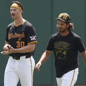 Pittsburgh Pirates pitchers Paul Skenes (left) and Jared Jones (right) walk in the outfield before the game against the Atlanta Braves at PNC Park.