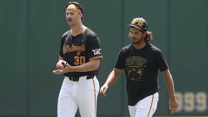 Pittsburgh Pirates pitchers Paul Skenes (left) and Jared Jones (right) walk in the outfield before the game against the Atlanta Braves at PNC Park.