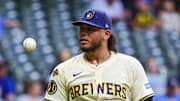 Aug 12, 2025; Milwaukee, Wisconsin, USA;  Milwaukee Brewers catcher William Contreras (24) tosses the ball to  starting pitcher Freddy Peralta (51) during a mound visit in the fourth inning against the Pittsburgh Pirates at American Family Field. Mandatory Credit: Benny Sieu-Imagn Images