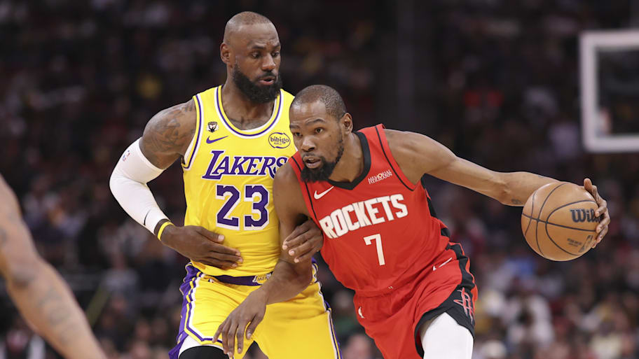 Houston Rockets forward Kevin Durant dribbles the ball as Los Angeles Lakers forward LeBron James defends.