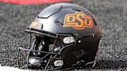 Oct 25, 2025; Lubbock, Texas, USA;  A general view of an Oklahoma State Cowboys helmet on the field before the game against the Texas Tech Red Raiders at Jones AT&T Stadium. Mandatory Credit: Michael C. Johnson-Imagn Images