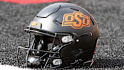 Oct 25, 2025; Lubbock, Texas, USA;  A general view of an Oklahoma State Cowboys helmet on the field before the game against the Texas Tech Red Raiders at Jones AT&T Stadium. Mandatory Credit: Michael C. Johnson-Imagn Images