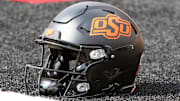 Oct 25, 2025; Lubbock, Texas, USA;  A general view of an Oklahoma State Cowboys helmet on the field before the game against the Texas Tech Red Raiders at Jones AT&T Stadium. Mandatory Credit: Michael C. Johnson-Imagn Images