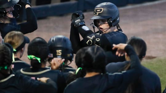 Purdue Boilermakers starting pitcher/relief pitcher Julia Gossett (33) celebrates with teammates