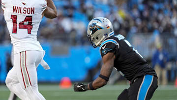 Dec 22, 2024; Charlotte, North Carolina, USA; Arizona Cardinals wide receiver Michael Wilson (14) jumps for a reception defended by Carolina Panthers cornerback Dane Jackson (23) during the second half at Bank of America Stadium. Mandatory Credit: Jim Dedmon-Imagn Images