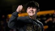 Then Iowa commit, Bo Bassett gives a thumbs up to the crowd during the FloWrestling Night in America event on Feb. 26, 2025 at Iowa's Xtream Arena in Coralville, Iowa. This weekend he reopened his recruitment.