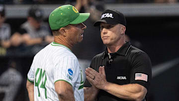 Oregon coach Mark Wasikowski reacts to the call by officials during he eighth inning against Utah Valley.