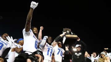 Dec 29, 2023; Memphis, TN, USA; Memphis Tigers players and head coach Ryan Silverfield celebrate after defeating the Iowa State Cyclones in the Liberty Bowl at Simmons Bank Liberty Stadium. Mandatory Credit: Petre Thomas-USA TODAY Sports