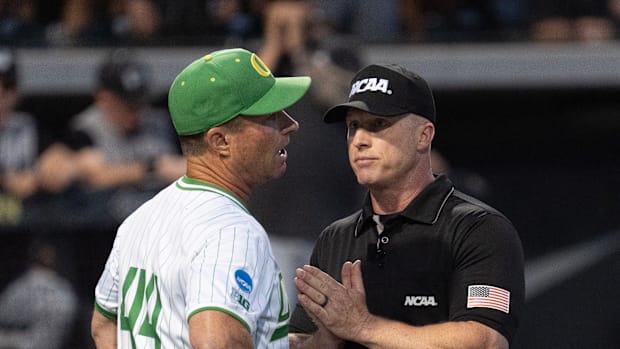 Oregon coach Mark Wasikowski reacts to the call by officials during he eighth inning against Utah Valley.