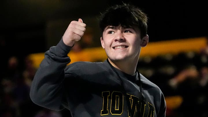 Former Iowa wrestling commit Bo Bassett gives a thumbs up to the crowd during the 2025 FloWrestling Night in America event in Iowa. Former Iowa wrestling commit Bo Bassett gives a thumbs up to the crowd during the 2025 FloWrestling Night in America event in Iowa.