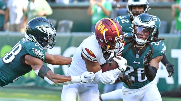 Oct 1, 2023; Philadelphia, Pennsylvania, USA; Washington Commanders wide receiver Jahan Dotson (1) catches touchdown pass against Philadelphia Eagles cornerback Josh Jobe (28) and safety Terrell Edmunds (26) during the fourth quarter at Lincoln Financial Field. Mandatory Credit: Eric Hartline-USA TODAY Sports