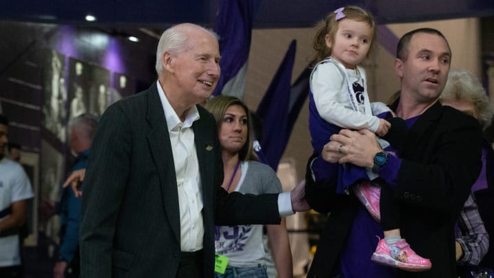 Former Kansas State football head coach Bill Snyder enters Bramlage Coliseum with his family before Tuesday's Sunflower Showdown against Kansas.