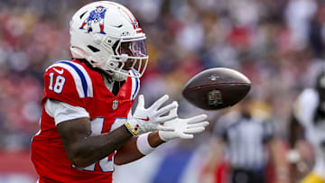 Sep 21, 2025; Foxborough, Massachusetts, USA; New England Patriots wide receiver Kyle Williams (18) completes a pass during the third quarter at Gillette Stadium.