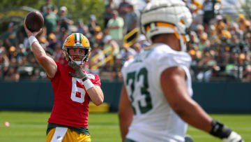 Green Bay Packers quarterback Sean Clifford passes the football during Practice 1 of training camp on Monday.