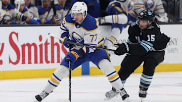 Mar 20, 2025; Salt Lake City, Utah, USA; Buffalo Sabres right wing JJ Peterka (77) skates against Utah Hockey Club center Alexander Kerfoot (15) during the third period at Delta Center. Mandatory Credit: Rob Gray-Imagn Images