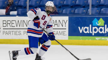 Feb 7, 2024; Plymouth, MI, USA; USA s Cole Hutson (23) skates up ice with the puck against Finland during the third period of the 2024 U18 s Five Nations Tournament at USA Hockey Arena. Mandatory Credit: David Reginek-USA TODAY Sports