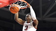Arkansas Razorbacks forward Adou Thiero (3) dunks the ball in the second half as Pacific Tigers forward Elias Ralph (2) defends at Bud Walton Arena. Arkansas won 91-72. 