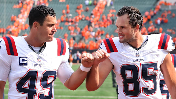 Sep 8, 2024; Cincinnati, Ohio, USA; New England Patriots tight end Hunter Henry (85) and long snapper Joe Cardona (49) celebrate following the win over the Cincinnati Bengals at Paycor Stadium. Mandatory Credit: Joseph Maiorana-Imagn Images