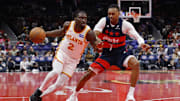 Nov 25, 2025; Washington, District of Columbia, USA; Atlanta Hawks guard Keaton Wallace (2) drives to the basket as Washington Wizards guard Bub Carrington (7) defends in the first half at Capital One Arena. Mandatory Credit: Geoff Burke-Imagn Images