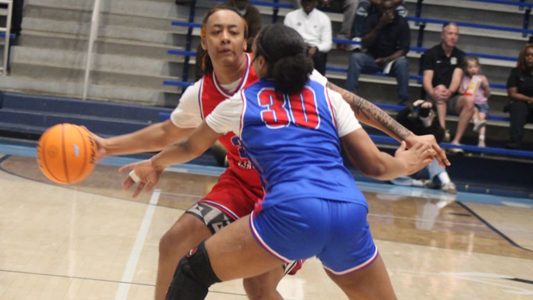 South Carolina forward LA Alexander is defended by North Carolina's Khiara Culliver 