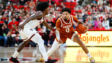 Dec 4, 2024; Raleigh, North Carolina, USA; Texas Longhorns guard Jordan Pope (0) dribbles with the ball during the second half of the game against the North Carolina State Wolfpack at Lenovo Center. Mandatory Credit: Jaylynn Nash-Imagn Images