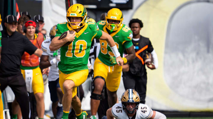 Oregon quarterback Luke Moga carries the ball as the Oregon Ducks host the Montana State Bobcats on Aug. 30, 2025, at Autzen Stadium in Eugene, Oregon.