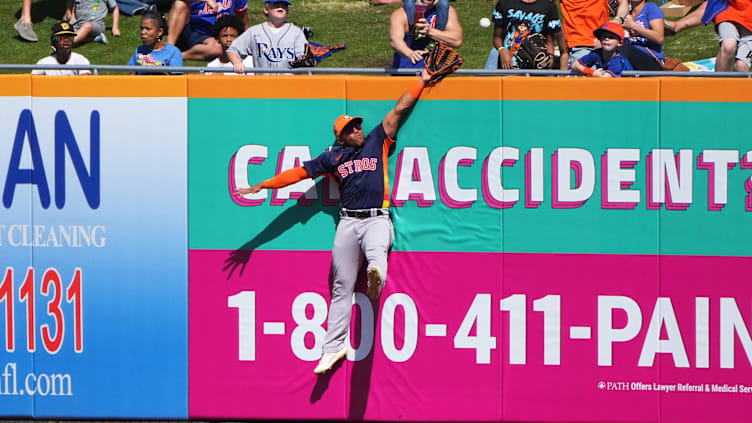 Feb 25, 2024; Port St. Lucie, Florida, USA;  Houston Astros right fielder Pedro Leon leaps to try to take away a two-run home run from New York Mets catcher Francisco Alvarez in the third inning at Clover Park. Mandatory Credit: Jim Rassol-USA TODAY Sports