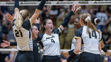Purdue Junior Kenna Wollard (4) and her squad celebrate the win