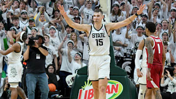 Nov 8, 2025; East Lansing, Michigan, USA;  Michigan State Spartans center Carson Cooper (15) starts the celebration as his team beats Arkansas at Jack Breslin Student Events Center. Mandatory Credit: Dale Young-Imagn Images