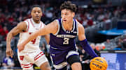 Mar 13, 2025; Indianapolis, IN, USA; Northwestern Wildcats guard Ty Berry (3) dribbles the ball while Wisconsin Badgers guard Kamari McGee (4) defends in the first half at Gainbridge Fieldhouse. Mandatory Credit: Trevor Ruszkowski-Imagn Images