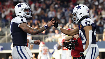 Nov 27, 2025; Arlington, Texas, USA; Dallas Cowboys quarterback Dak Prescott (4) and Dallas Cowboys running back Malik Davis (43) celebrate after a touchdown against the Kansas City Chiefs during the second quarter at AT&T Stadium. 