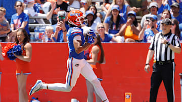 Apr 12, 2025; Gainesville, FL, USA; Florida Gators wide receiver Aidan Mizell (11) scores a touchdown during the first half at Ben Hill Griffin Stadium. Mandatory Credit: Matt Pendleton-Imagn Images