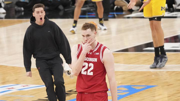 Mar 14, 2026; Chicago, IL, USA; Wisconsin Badgers forward Austin Rapp (22) reacts after making a three point basket against the Michigan Wolverines during the first half at United Center. Mandatory Credit: David Banks-Imagn Images