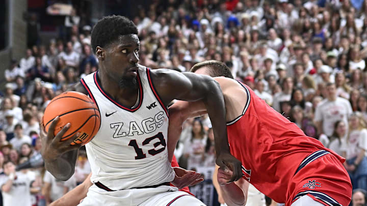 Feb 22, 2025; Spokane, Washington, USA; Gonzaga Bulldogs forward Graham Ike (13) is fouled on the shot by St. Mary's Gaels center Mitchell Saxen (11) in the second half at McCarthey Athletic Center. Mandatory Credit: James Snook-Imagn Images