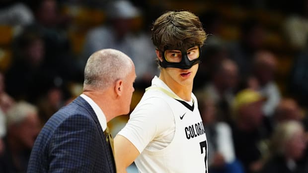 Colorado Buffaloes forward Sebastian Rancik (7) listens to head coach Tad Boyle in the first half at CU Events Center. 