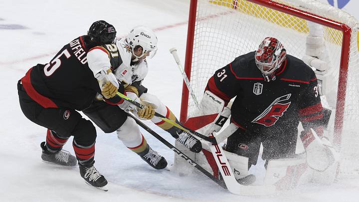 Jun 4, 2026; Raleigh, North Carolina, USA; Carolina Hurricanes goaltender Frederik Andersen (31) and defenseman Jalen Chatfield (5) defend against Vegas Golden Knights center Brett Howden (21) during the second period in game two of the 2026 Stanley Cup Final at Lenovo Center. Mandatory Credit: Nathan Ray Seebeck-Imagn Images