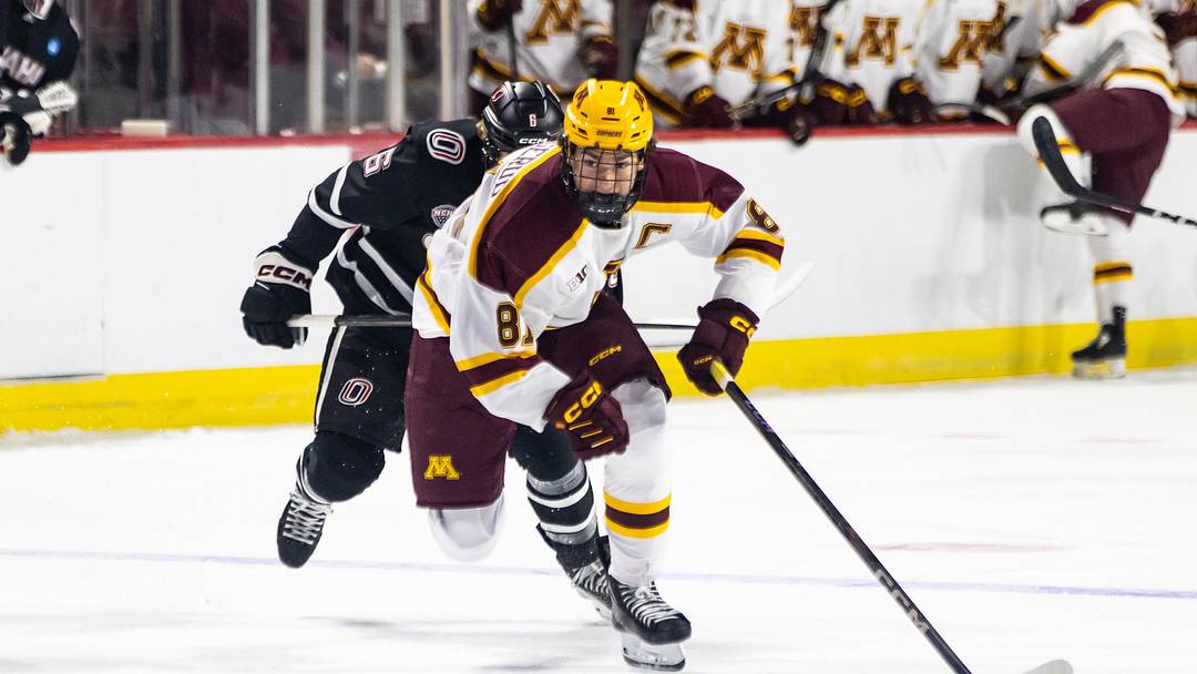 Minnesota forward Jimmy Snuggerud, front, skates with the puck against Omaha during the Ice Breaker Tournament on Oct. 12, 2024, in Las Vegas. Minnesota forward Jimmy Snuggerud, front, skates with the puck against Omaha during the Ice Breaker Tournament on Oct. 12, 2024, in Las Vegas.