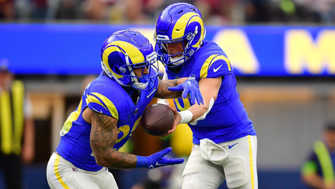 Dec 17, 2023; Inglewood, California, USA; Los Angeles Rams quarterback Matthew Stafford (9) hands off to running back Kyren Williams (23) against the Washington Commanders during the first half at SoFi Stadium. Mandatory Credit: Gary A. Vasquez-Imagn Images Dec 17, 2023; Inglewood, California, USA; Los Angeles Rams quarterback Matthew Stafford (9) hands off to running back Kyren Williams (23) against the Washington Commanders during the first half at SoFi Stadium. Mandatory Credit: Gary A. Vasquez-Imagn Images